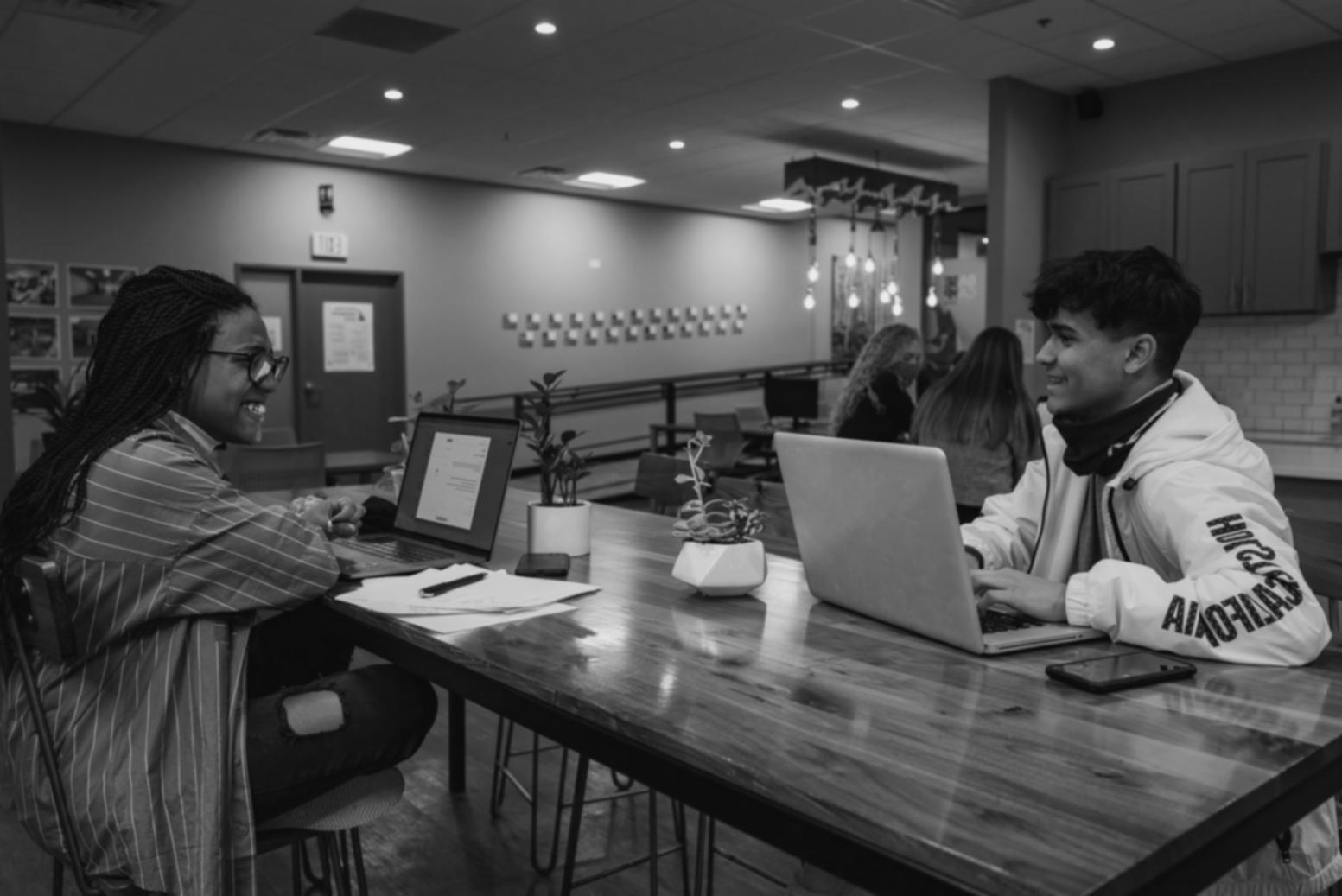 Collaborative seminar environment with participants discussing investment topics